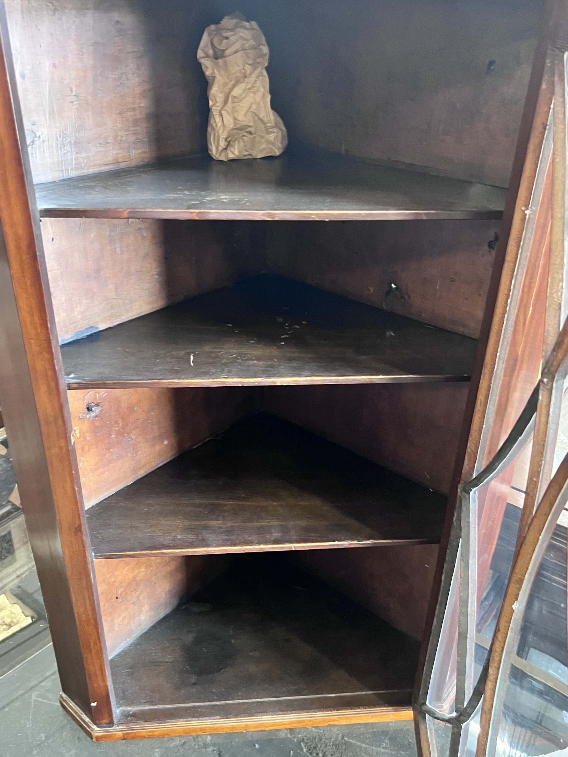 A George III inlaid mahogany hanging corner cupboard, width 64cm, depth 38cm, height 100cm